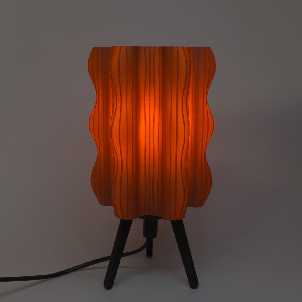 The Ripple Lamp in Brown, glowing